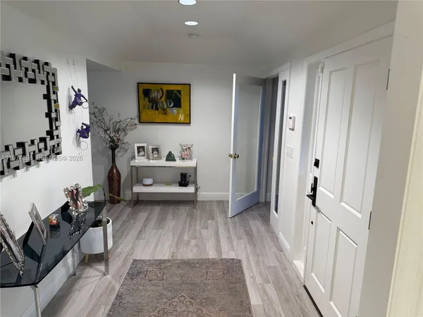 a view of a hallway with a couch