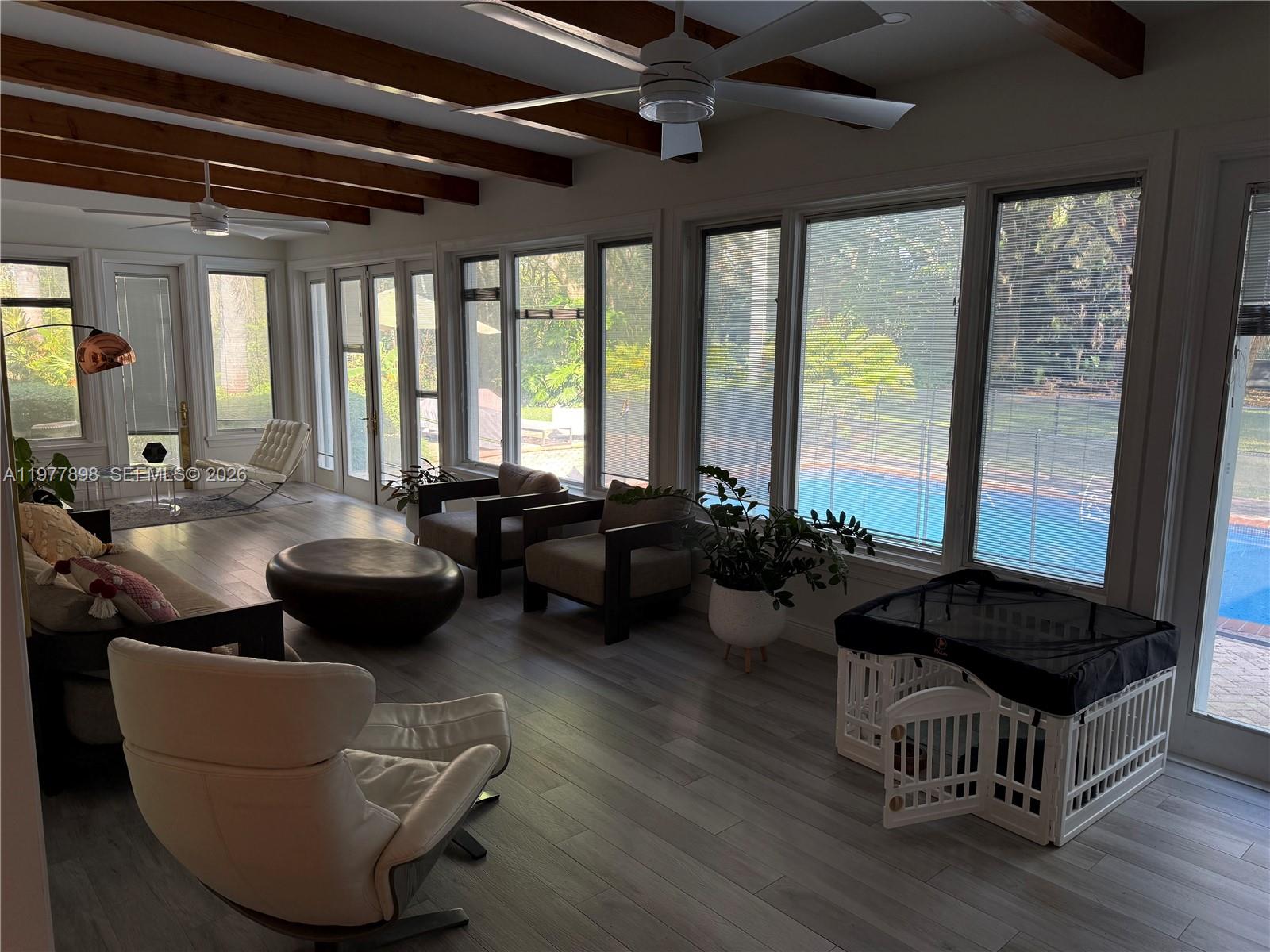 6399 Southwest 100th Street Pinecrest, FL 33156 - Photo 9 of 21 a living room with furniture and a large window