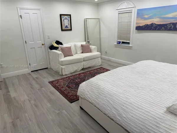 a bed room with a bed and a couch