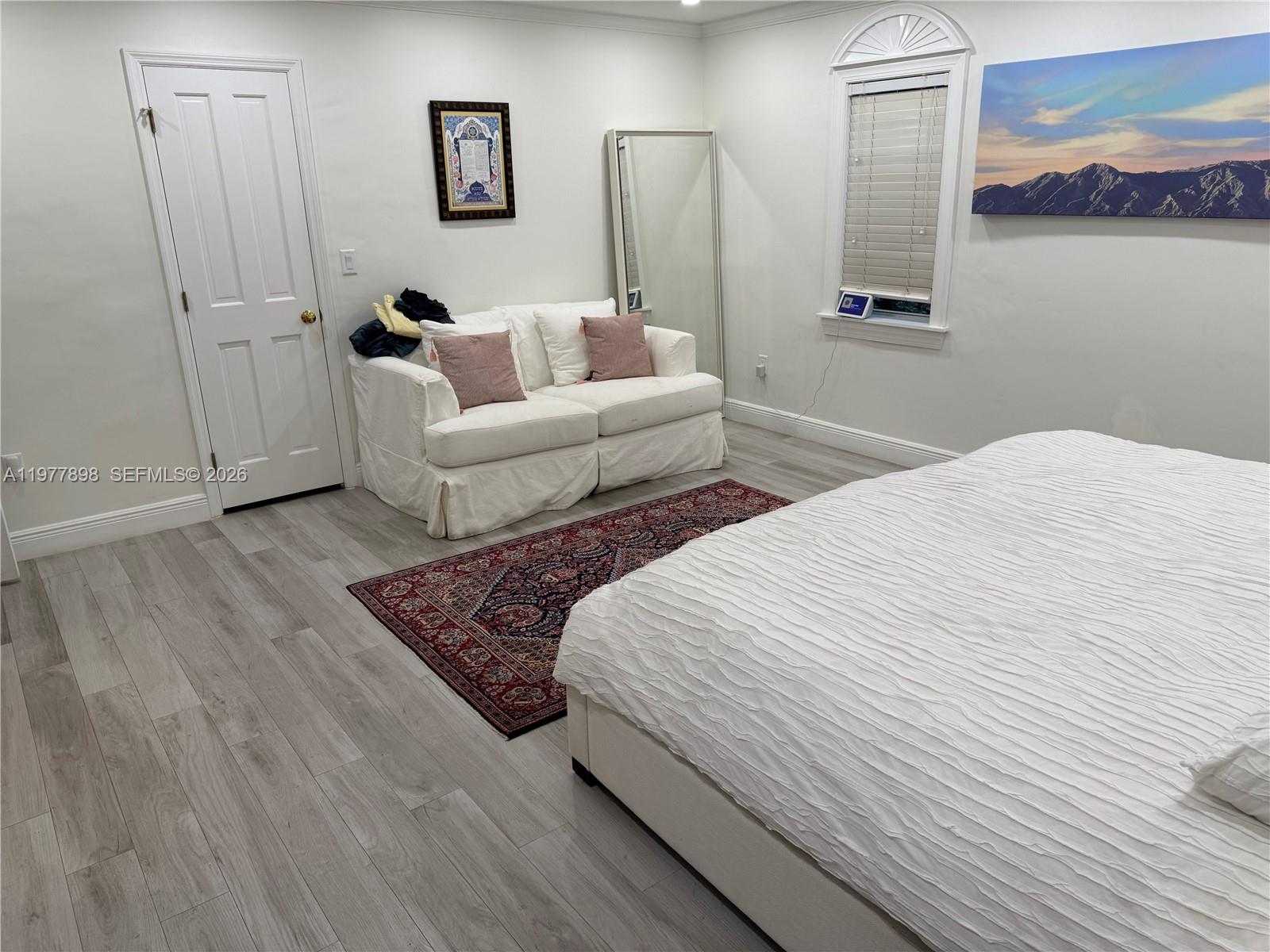 6399 Southwest 100th Street Pinecrest, FL 33156 - Photo 10 of 21 a bed room with a bed and a couch