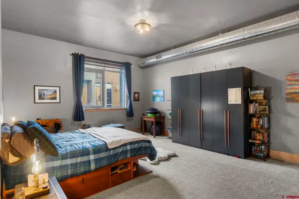 a bedroom with a bed and a bed