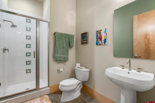 a view of a hallway with entryway wooden floor and front door