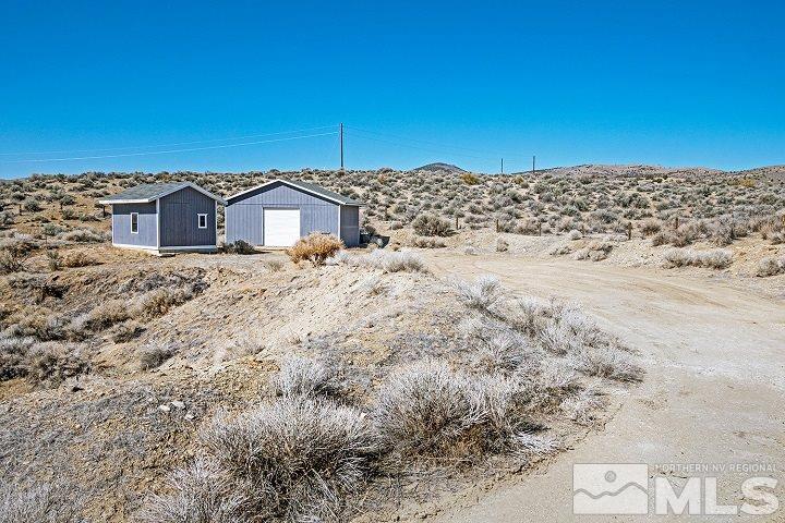 5200 Jackrabbit Road Reno, NV 89510 - Photo 1 of 13 a view of a wooden house with a yard
