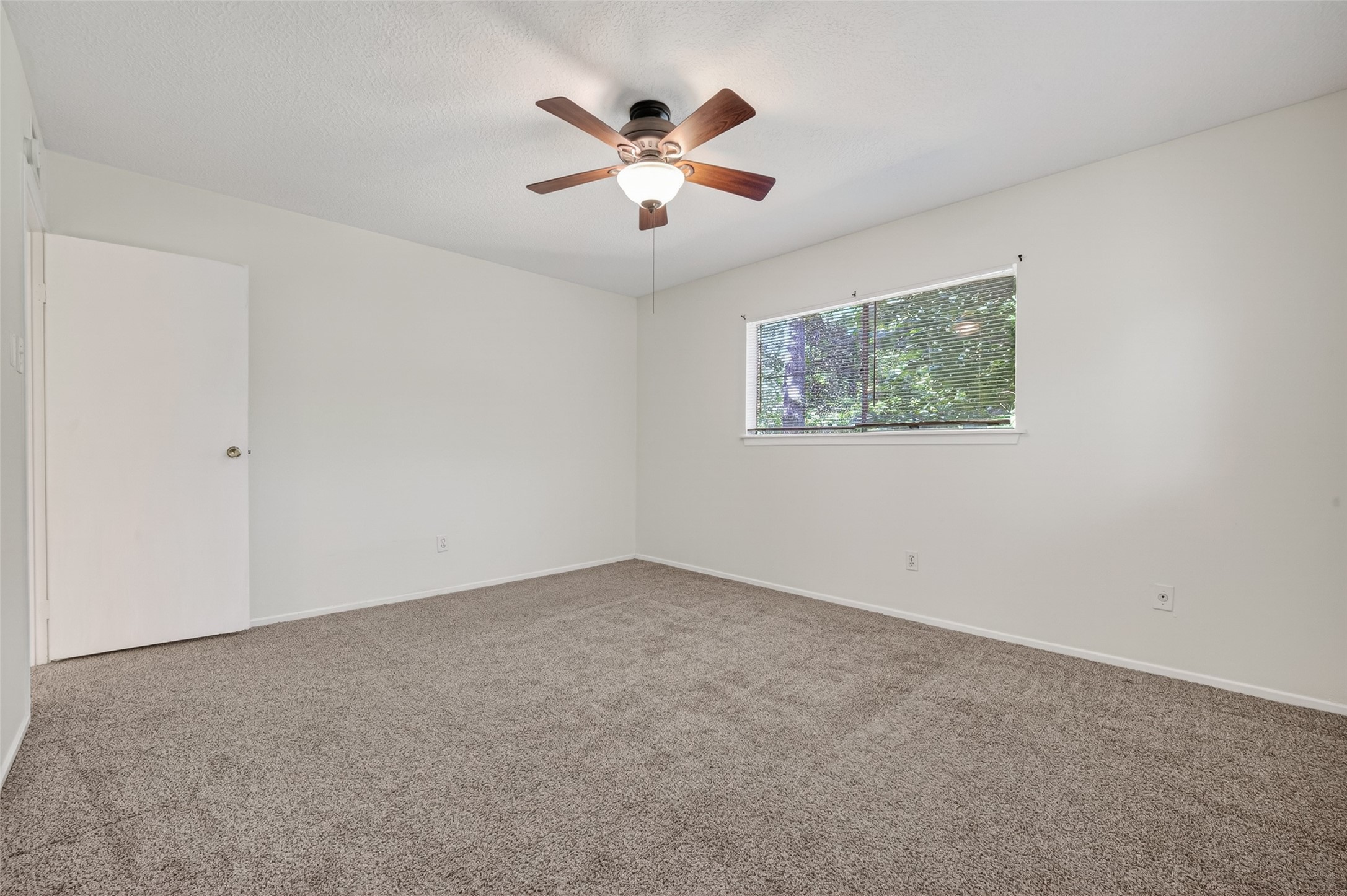 1106 East Red Cedar Circle Spring, TX 77380 - Photo 33 of 43 an empty room with ceiling fan and window