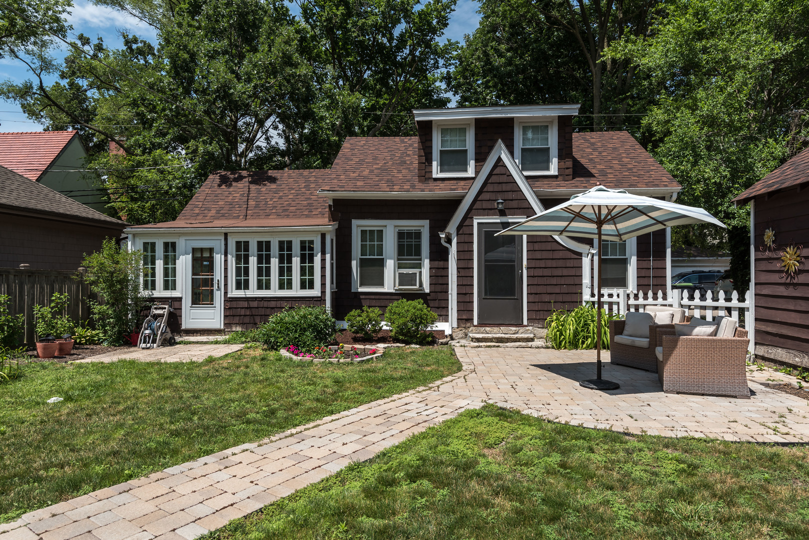 2109 Colfax Street Evanston, IL 60201 - Photo 1 of 12 a front view of a house with yard and green space