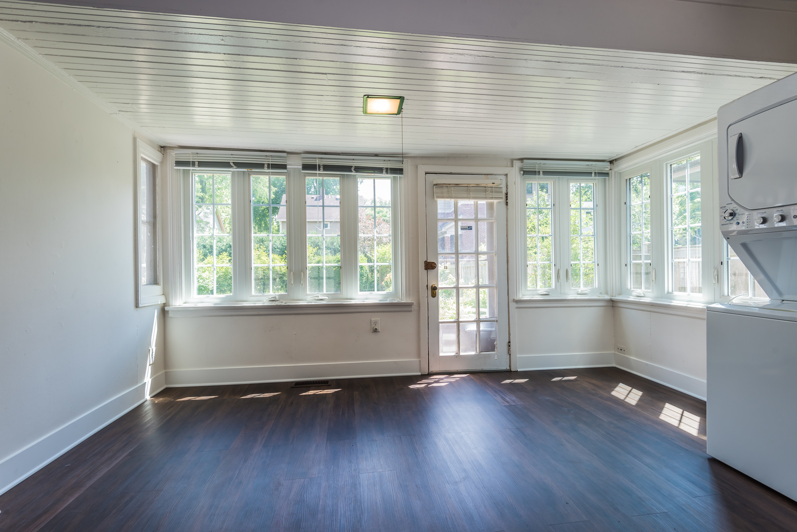 2109 Colfax Street Evanston, IL 60201 - Photo 2 of 12 an empty room with wooden floor and windows