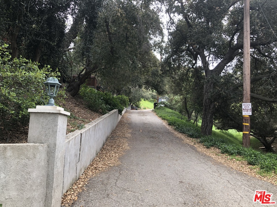 20526 Callon Drive Topanga, CA 90290 - Photo 6 of 30 a view of a pathway with a wrought fence