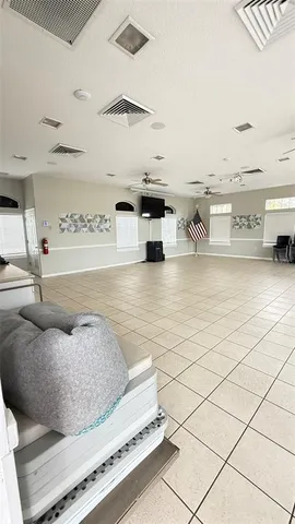 a living room with furniture and white walls