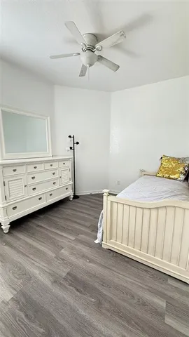 a bedroom with a bed and a dresser