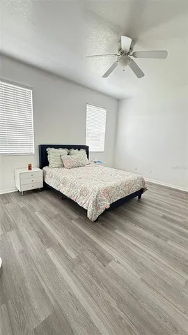 a bedroom with a bed and window