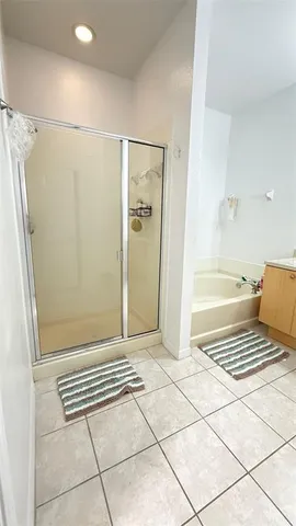 a white toilet sitting next to a white wall