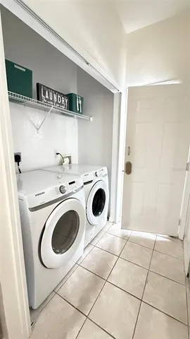 a bedroom with a bed and a ceiling fan