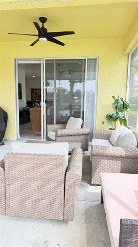 a view of a white house next to a yard