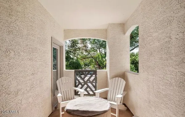 a view of a room with furniture and a window