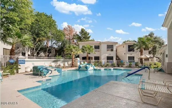 a view of a swimming pool with a patio