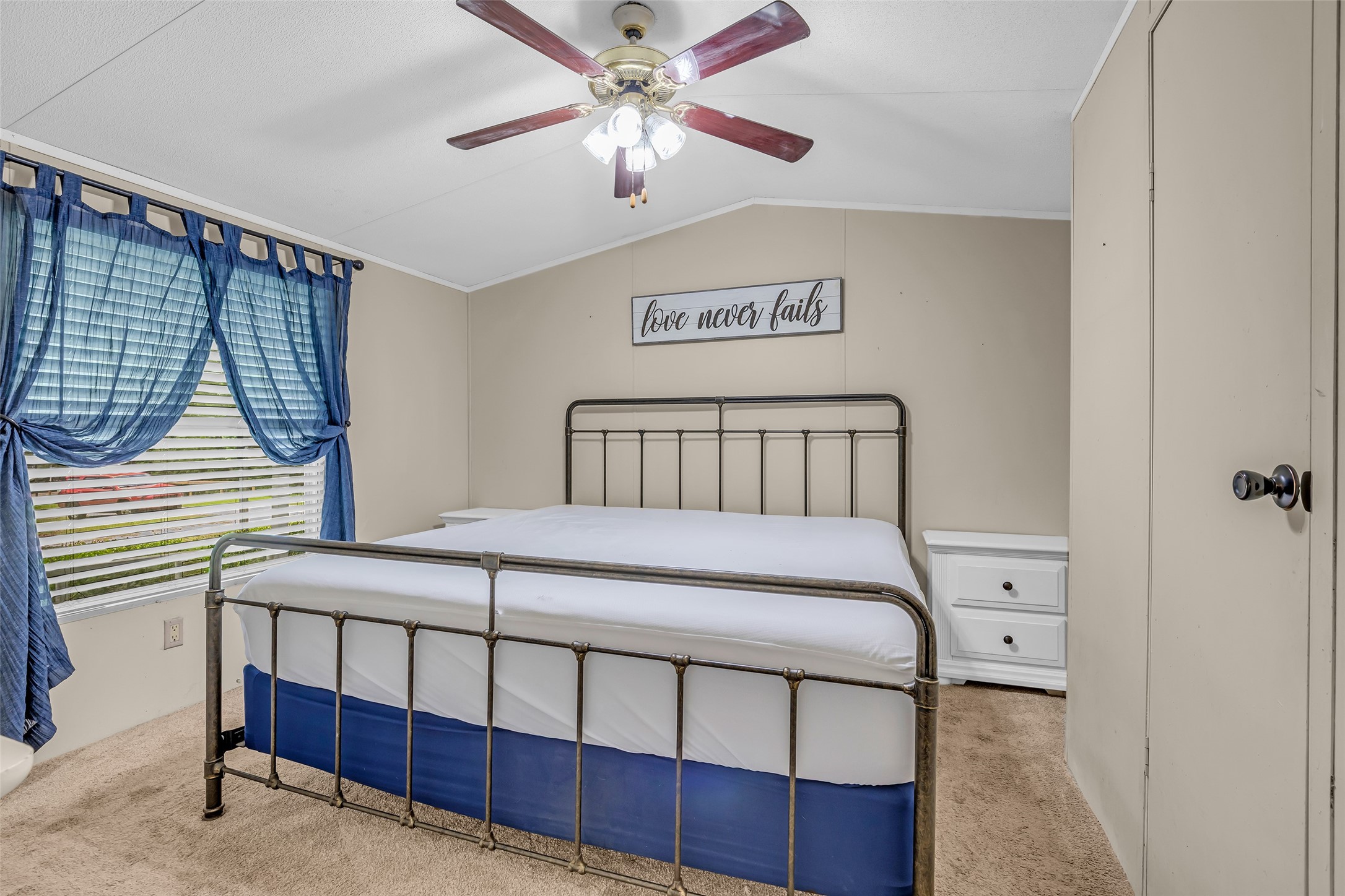 188 Chrissy Lane Trinity, TX 75862 - Photo 15 of 25 a bedroom with a bed and a chandelier