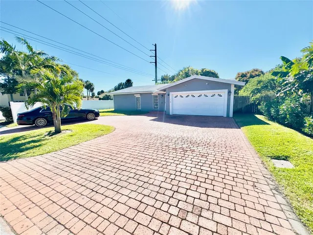 a view of a backyard of the house