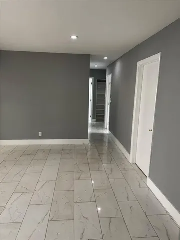 a kitchen with stainless steel appliances a refrigerator sink and microwave