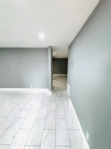 a kitchen with stainless steel appliances a refrigerator sink and microwave