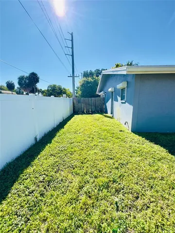 a backyard of a house with lots of green space