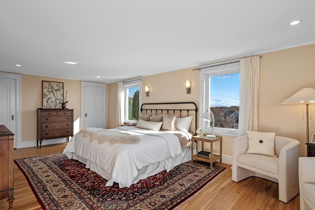 21 Bay View Drive Swampscott, MA 01907 - Photo 26 of 42 a spacious bedroom with a large bed and a couch