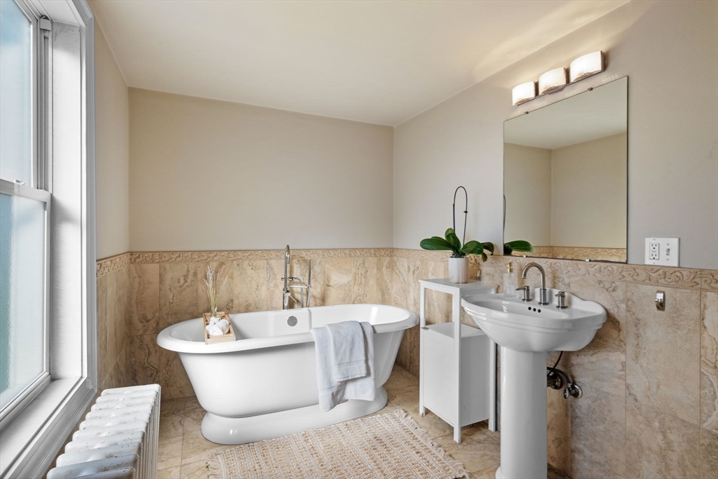 21 Bay View Drive Swampscott, MA 01907 - Photo 27 of 42 a bathroom with a sink and a mirror