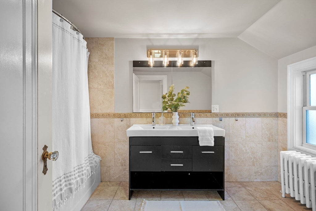 21 Bay View Drive Swampscott, MA 01907 - Photo 33 of 42 a room with a sink and a mirror