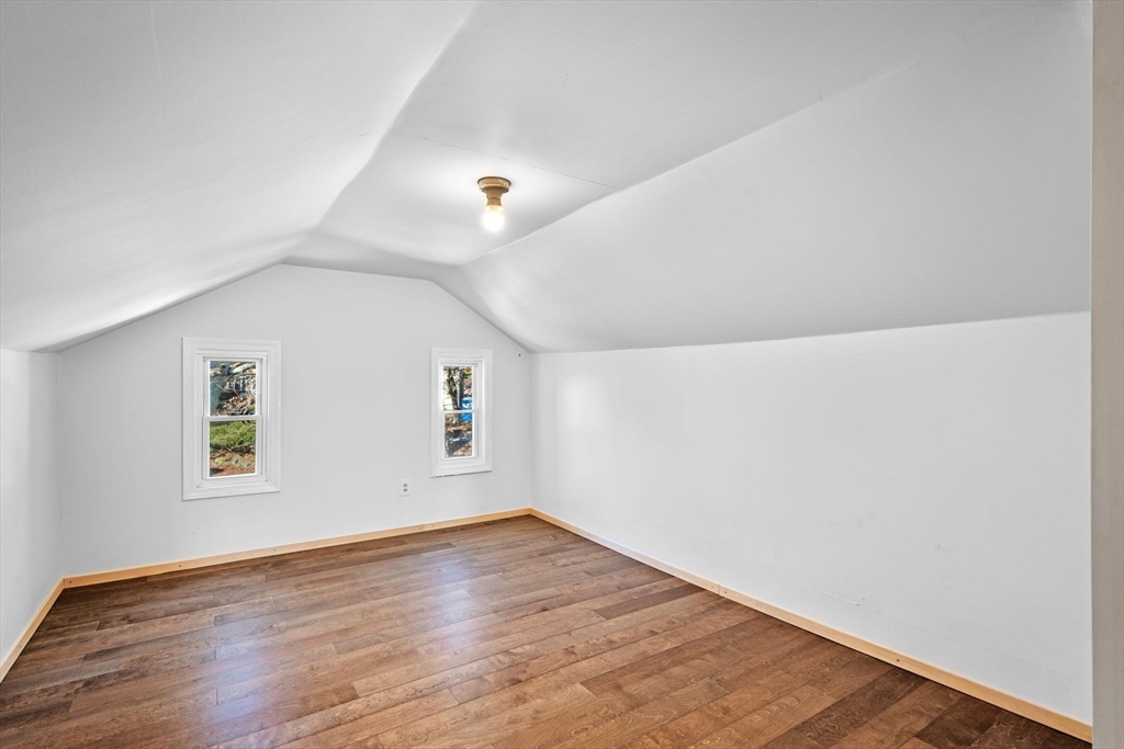 21 Bay View Drive Swampscott, MA 01907 - Photo 38 of 42 an empty room with wooden floor and windows