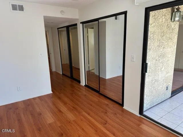 a view of front door with wooden floor