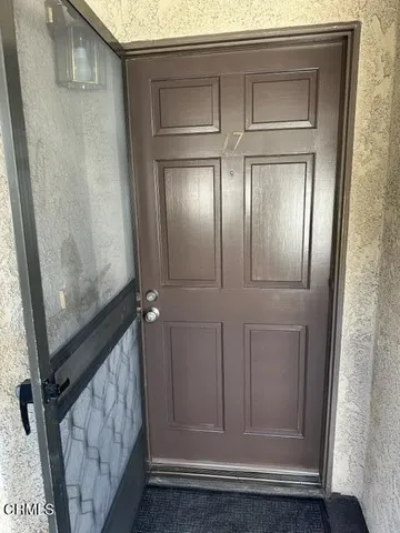 a view of staircase with wooden floor