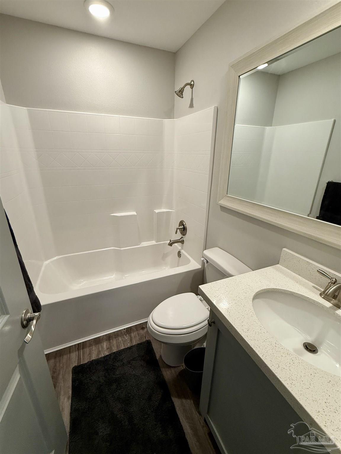 5553 Riviera Drive Milton, FL 32583 - Photo 15 of 23 a bathroom with a sink a toilet and shower