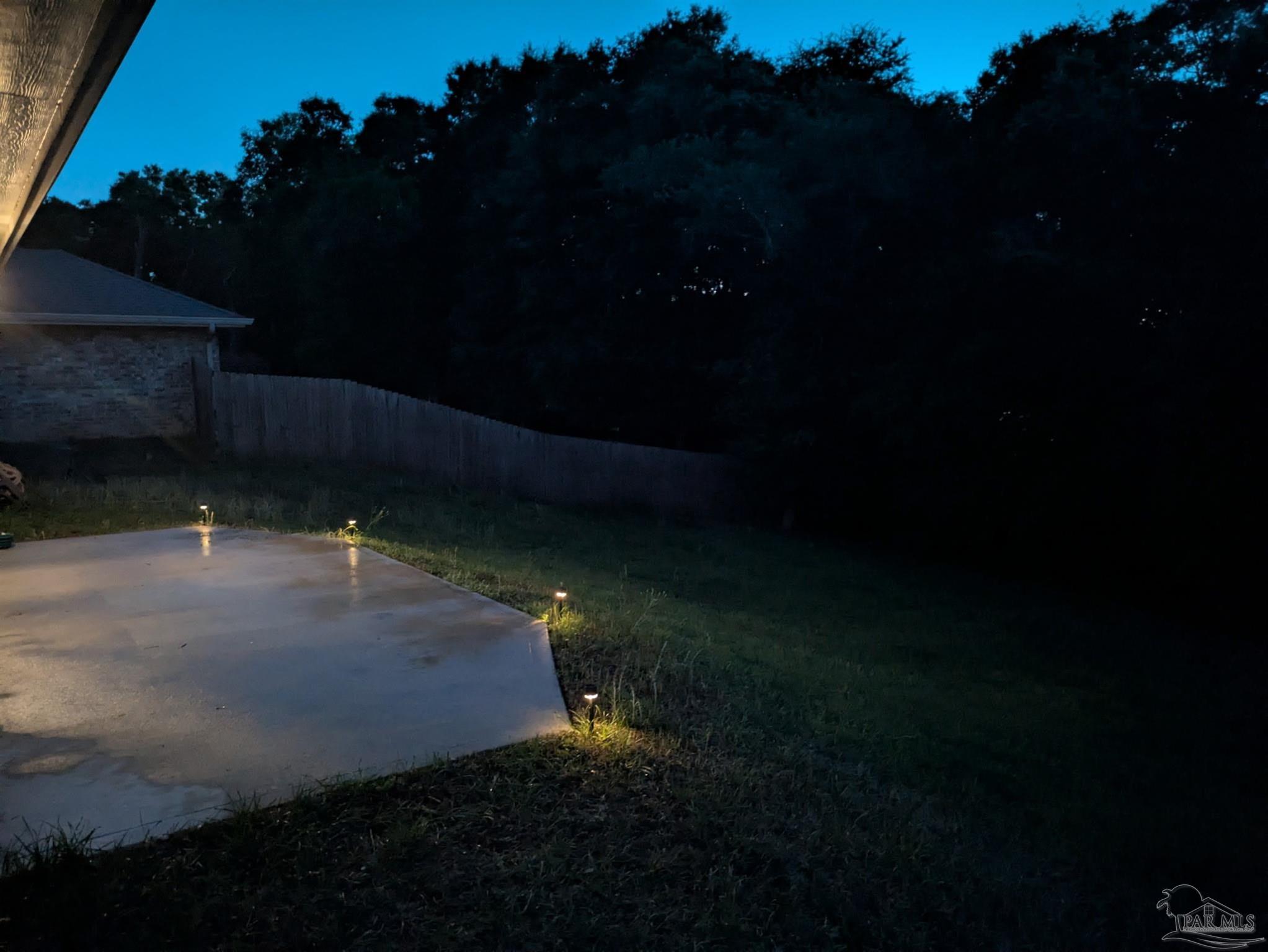 5553 Riviera Drive Milton, FL 32583 - Photo 21 of 23 a view of a backyard of the house
