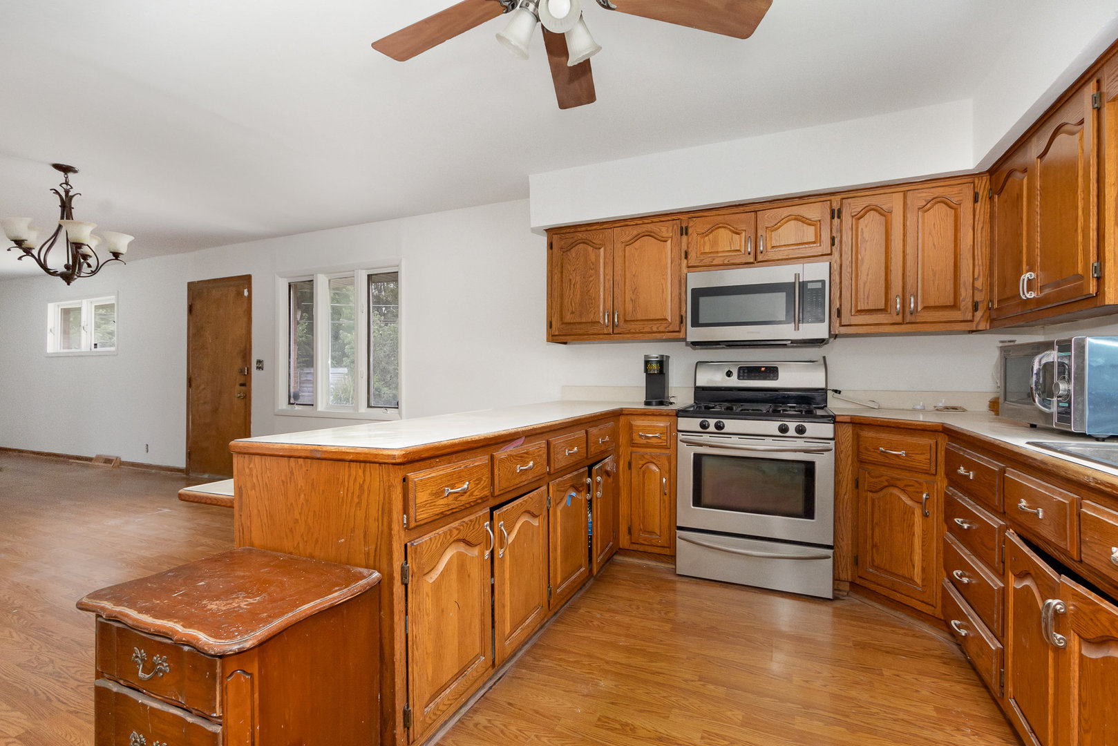 636 Patterson Road Joliet, IL 60436 - Photo 6 of 16 a kitchen with stainless steel appliances granite countertop a stove a sink and a refrigerator