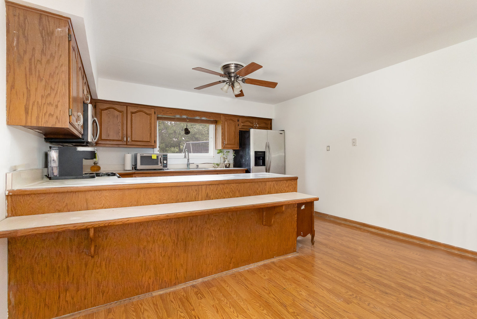 636 Patterson Road Joliet, IL 60436 - Photo 8 of 16 a view of a kitchen with a sink and cabinet