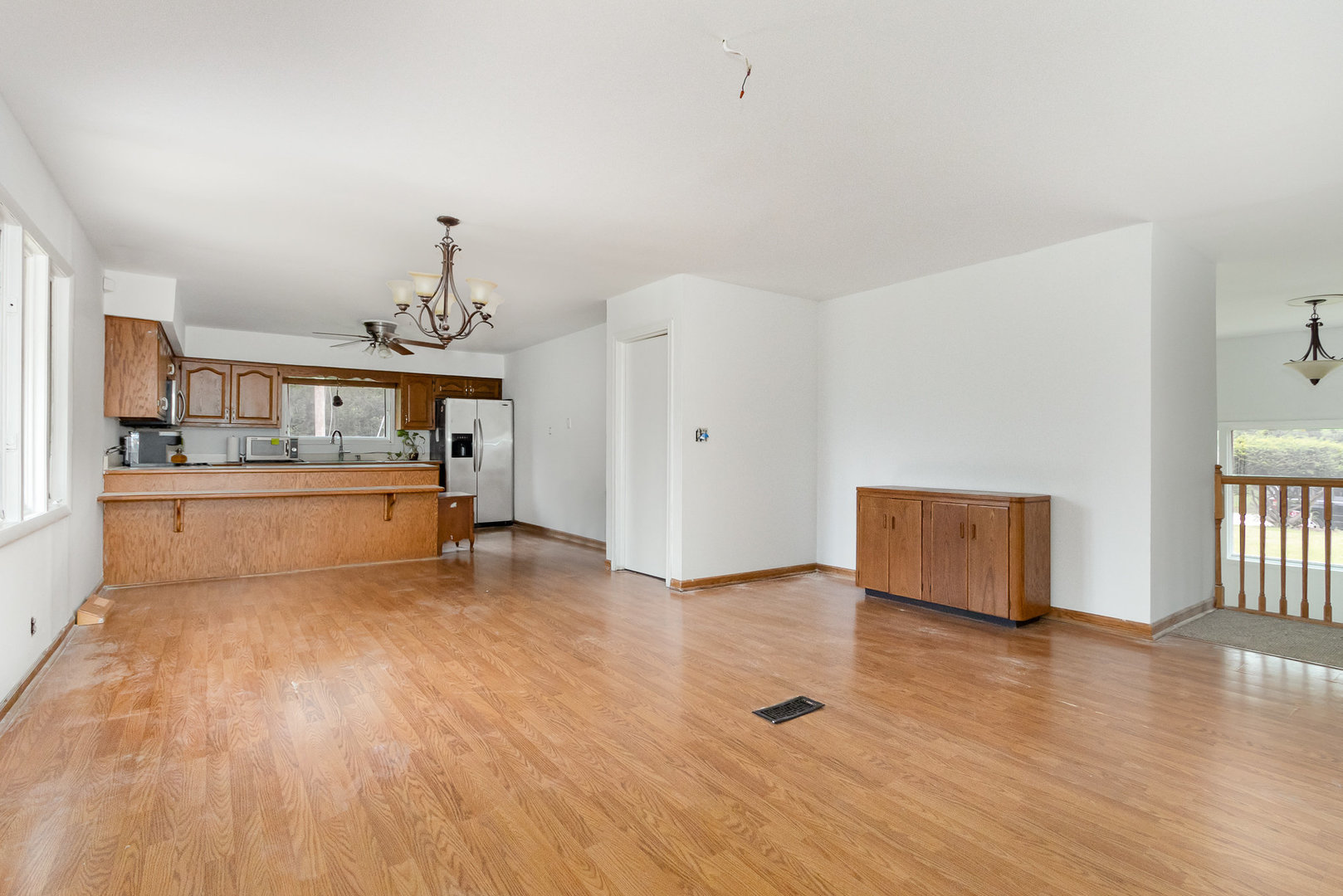636 Patterson Road Joliet, IL 60436 - Photo 9 of 16 a view of a kitchen with furniture and wooden floor