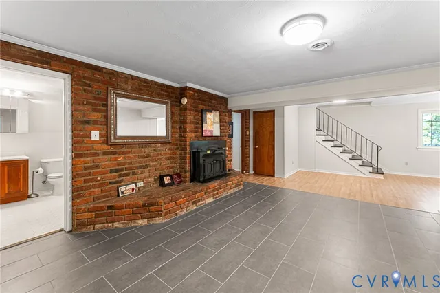 a view of an entryway with wooden floor