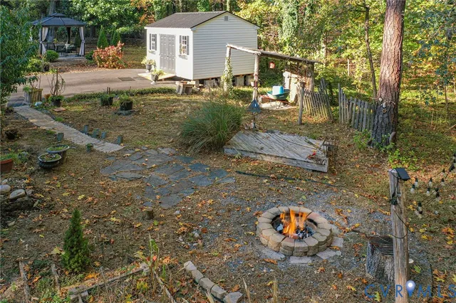 a backyard of a house with yard and outdoor seating