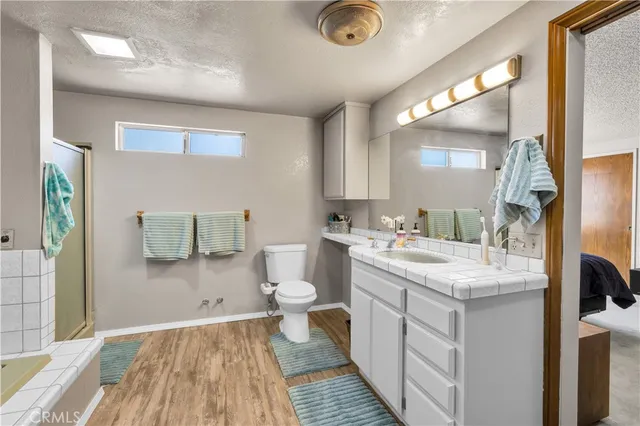 a view of a house with a yard and covered with snow