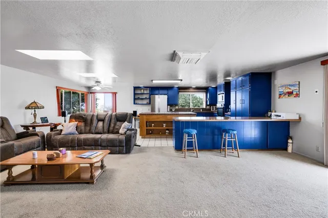 a living room with furniture flat screen tv and a fireplace