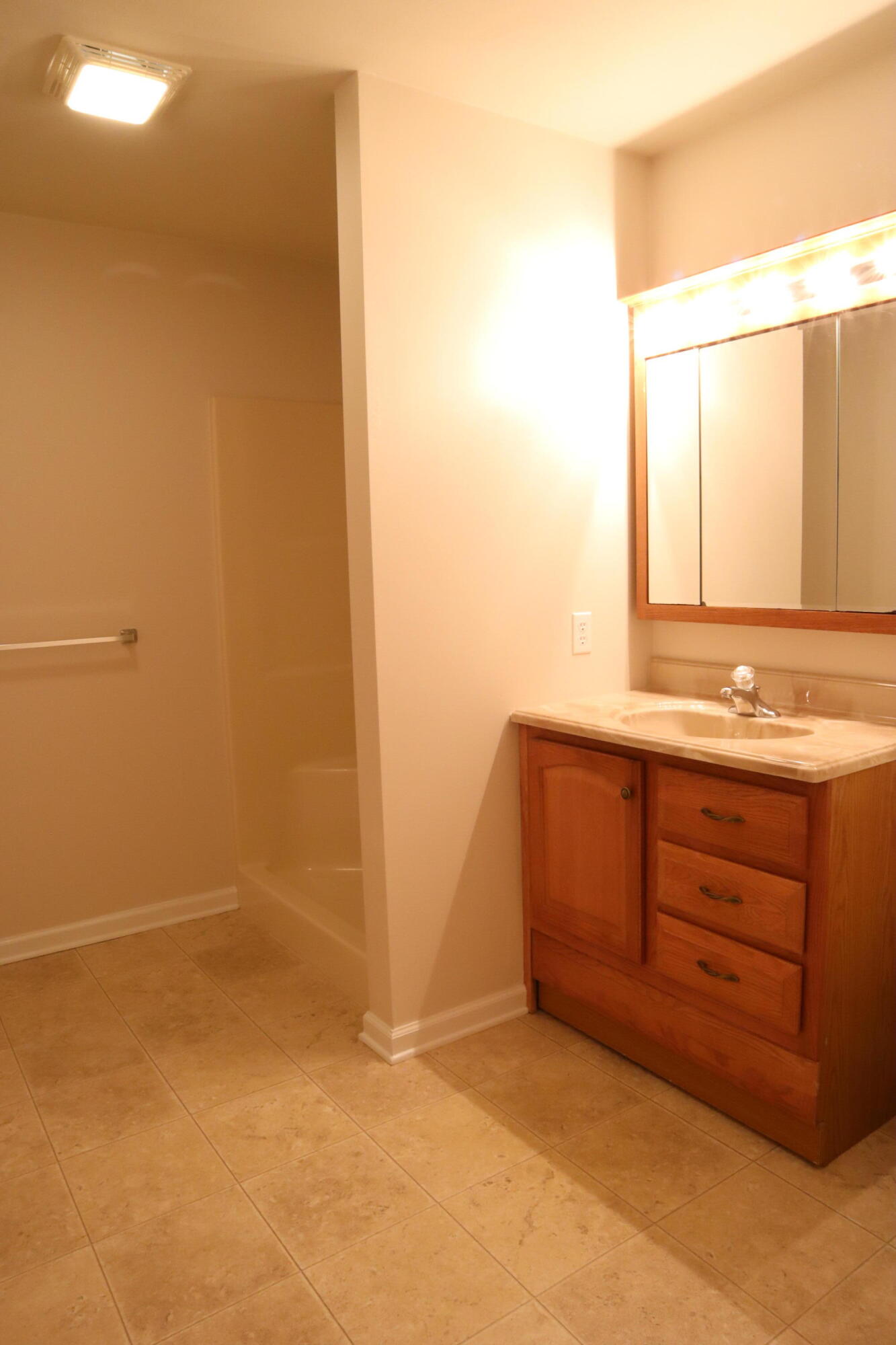 3305 Troxell Road Southeast Roanoke, VA 24014 - Photo 10 of 14 a bathroom with a granite countertop sink and a mirror
