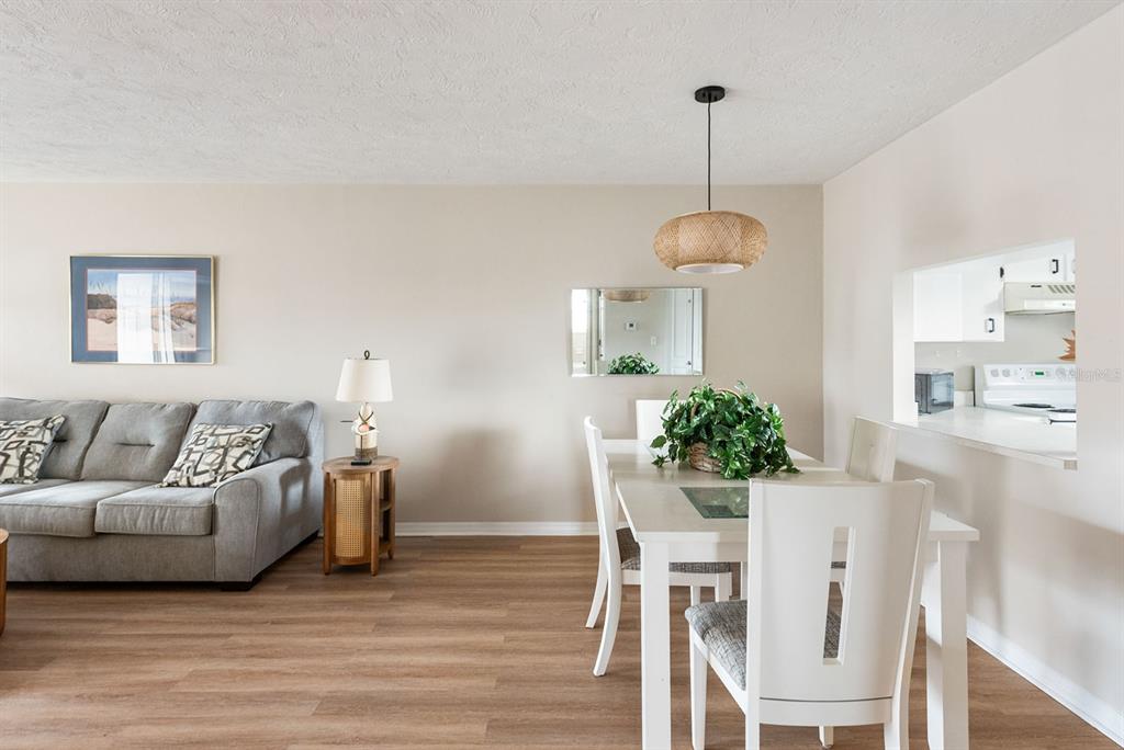 1531 Placida Road, Unit 1204 Englewood, FL 34223 - Photo 12 of 58 a living room with furniture and a table