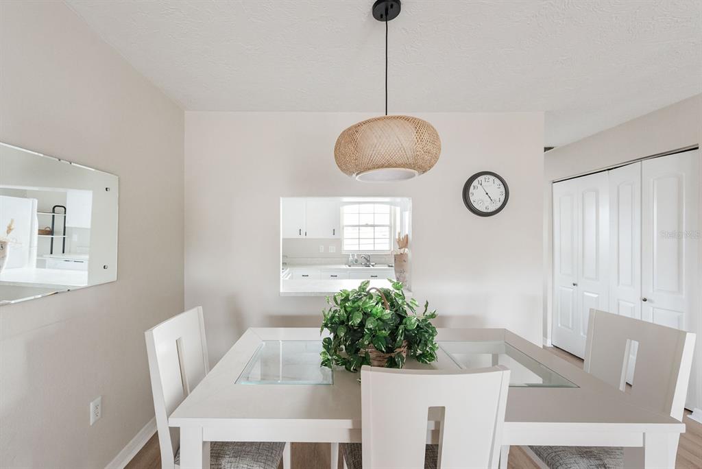 1531 Placida Road, Unit 1204 Englewood, FL 34223 - Photo 14 of 58 a living room with furniture and a chandelier