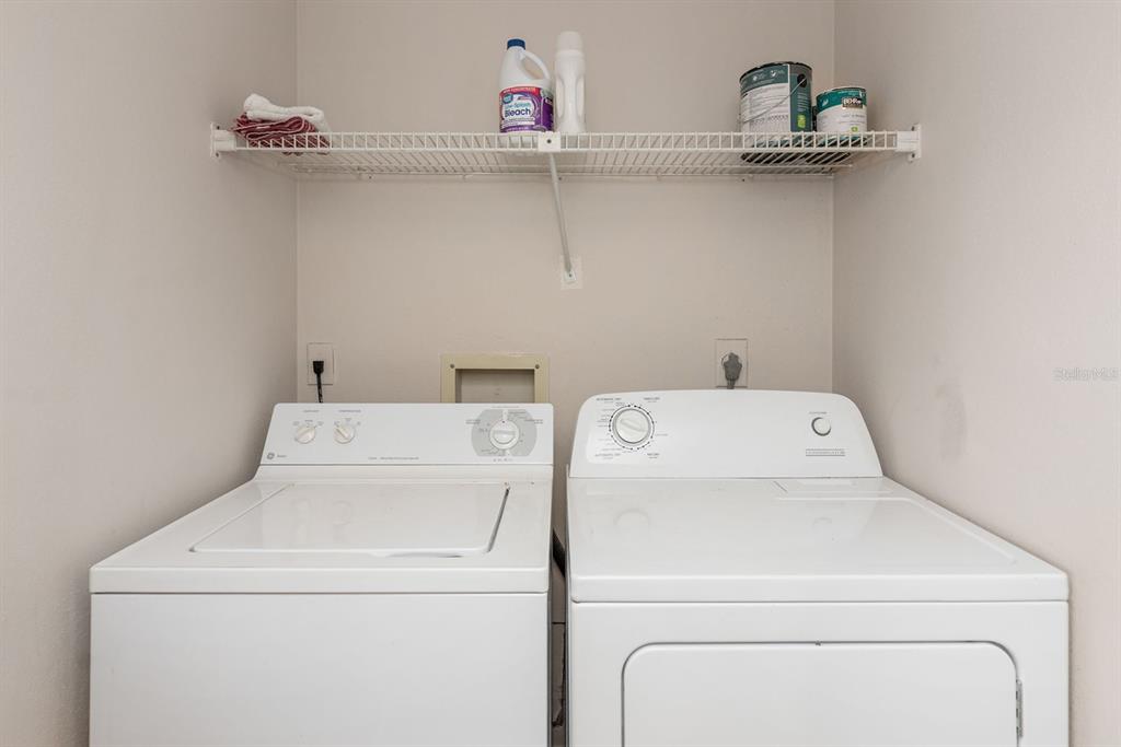 1531 Placida Road, Unit 1204 Englewood, FL 34223 - Photo 22 of 58 a utility room with dryer and washer