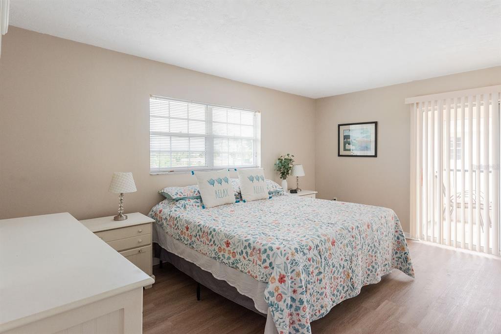 1531 Placida Road, Unit 1204 Englewood, FL 34223 - Photo 24 of 58 a bedroom with a bed and window