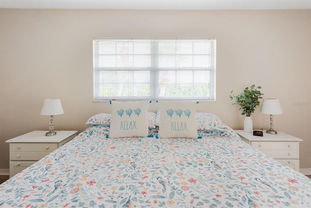 1531 Placida Road, Unit 1204 Englewood, FL 34223 - Photo 25 of 58 a white bath tub sitting in a bedroom next to a window