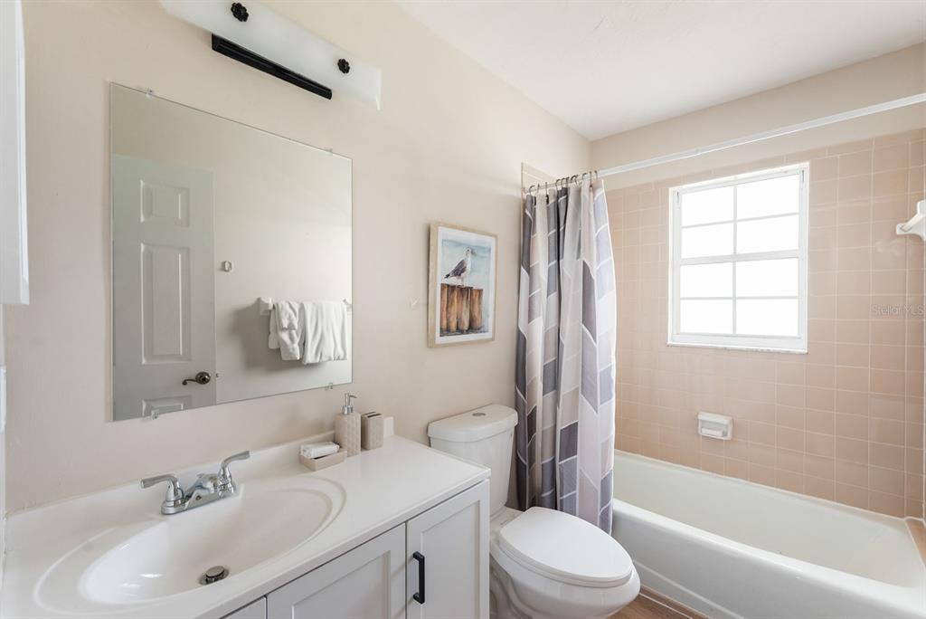 1531 Placida Road, Unit 1204 Englewood, FL 34223 - Photo 30 of 58 a bathroom with a sink toilet and shower