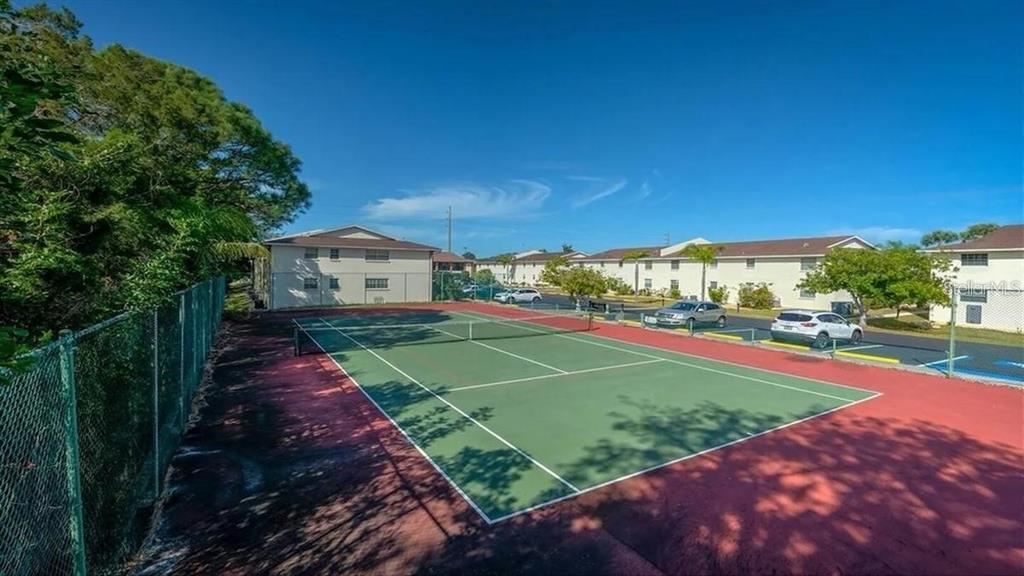1531 Placida Road, Unit 1204 Englewood, FL 34223 - Photo 38 of 58 a view of a backyard with a garden
