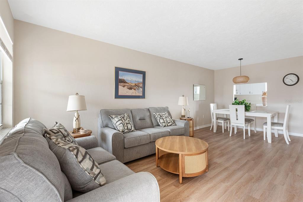 1531 Placida Road, Unit 1204 Englewood, FL 34223 - Photo 5 of 58 a living room with furniture and a wooden floor