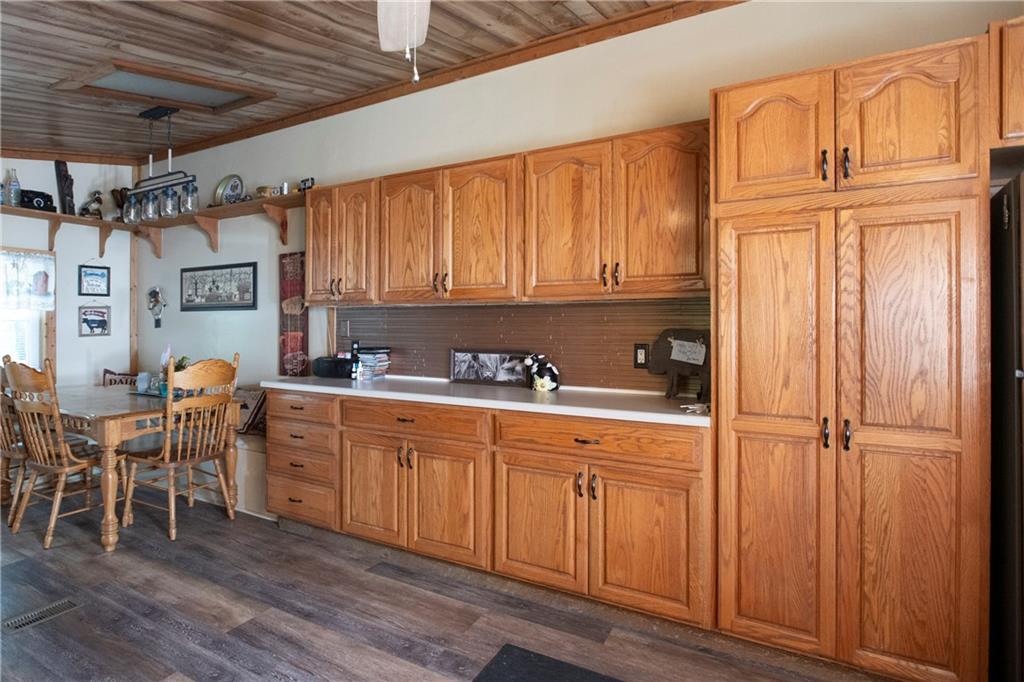 9133 South Watson Run Road Meadville, PA 16335 - Photo 9 of 45 a kitchen with stainless steel appliances granite countertop a refrigerator and wooden cabinets