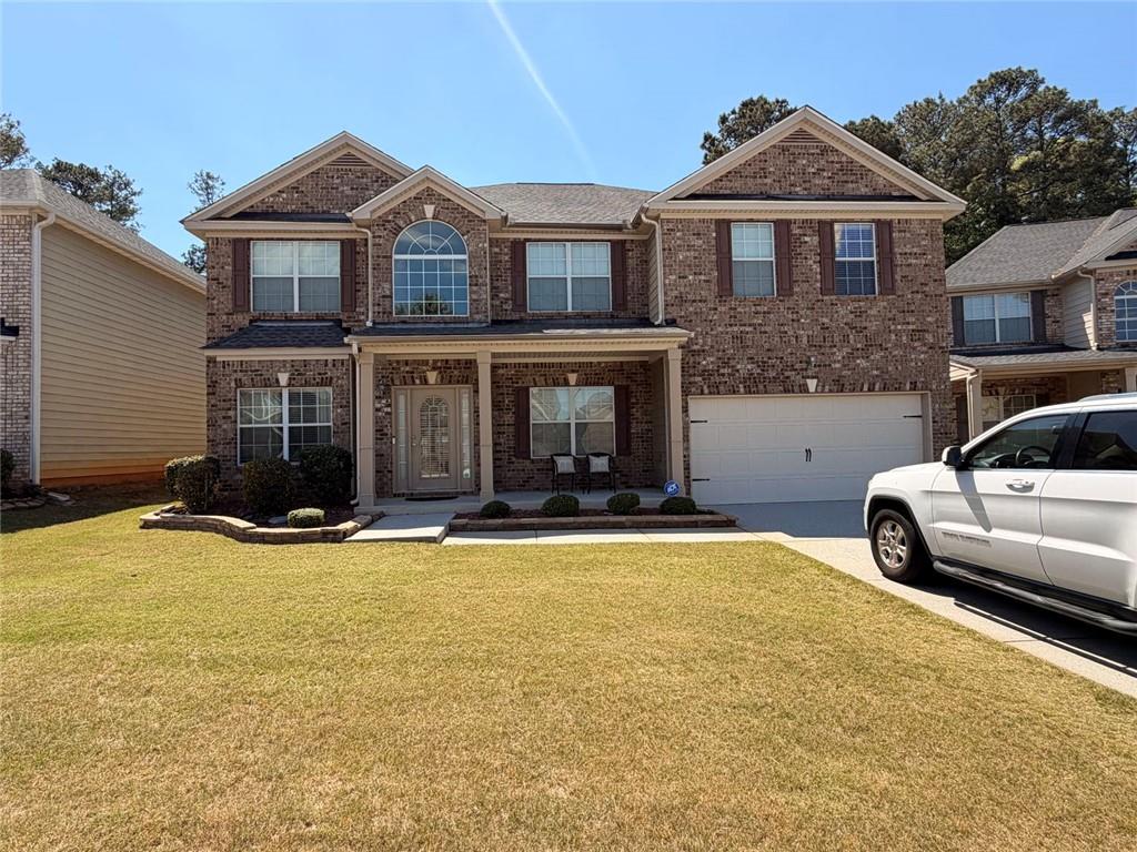 a front view of a house with yard